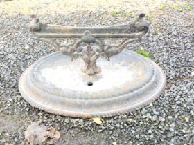 A Victorian oval cast iron bootscraper with ropetwist cast base, and blade on pierced scrolled