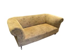 A reproduction 6ft chesterfield style sofa with padded back and arms above a sprung seat, raised