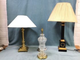 A hexagonal brass tablelamp on square plinth fitted with conical shade; a ribbed glass tablelamp