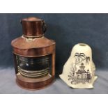 A copper and brass port ships lantern with fresnel lens and sliding door panel - 10in; and a