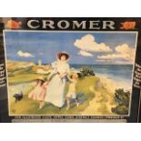 An Edwardian colour printed travel poster advertising Cromer, depicting a lady and children on a