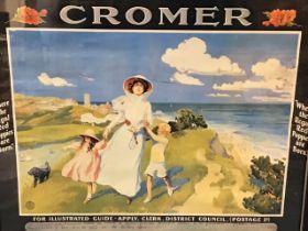 An Edwardian colour printed travel poster advertising Cromer, depicting a lady and children on a