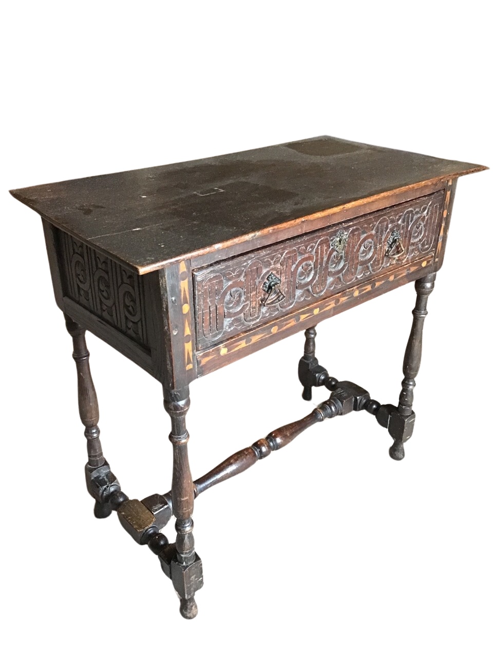 A Victorian oak side table with later alterations, the rectangular top above a blind fretwork carved
