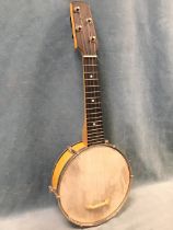 An ash and chromed metal banjolele, the resonator with parchment head and decorative chromed back,