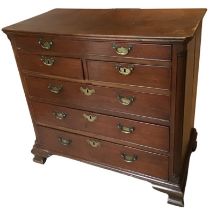 A Georgian mahogany chest of drawers with rectangular canted top and quartered pillars to corners