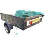 A rectangular trailer with wood frame to box, the axel with mudguards to wheels, the towbar with
