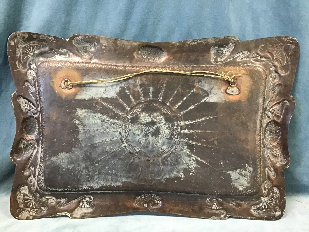 An Edwardian hand-beaten art nouveau copper tray, with central flowerhead and sunburst motif - Image 3 of 3