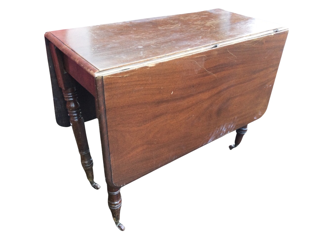 A Victorian mahogany drop leaf dining table, the moulded rectangular top with two leaves opening