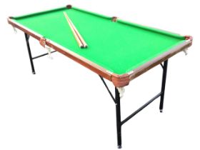 An Ambassador mahogany framed folding snooker table and two cues, the baize top with net pockets,