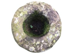 A circular ancient stone mortar of bowl shape. (19in)