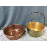 A heavy nineteenth century copper pan with rolled rim and riveted splayed handles; and a Victorian