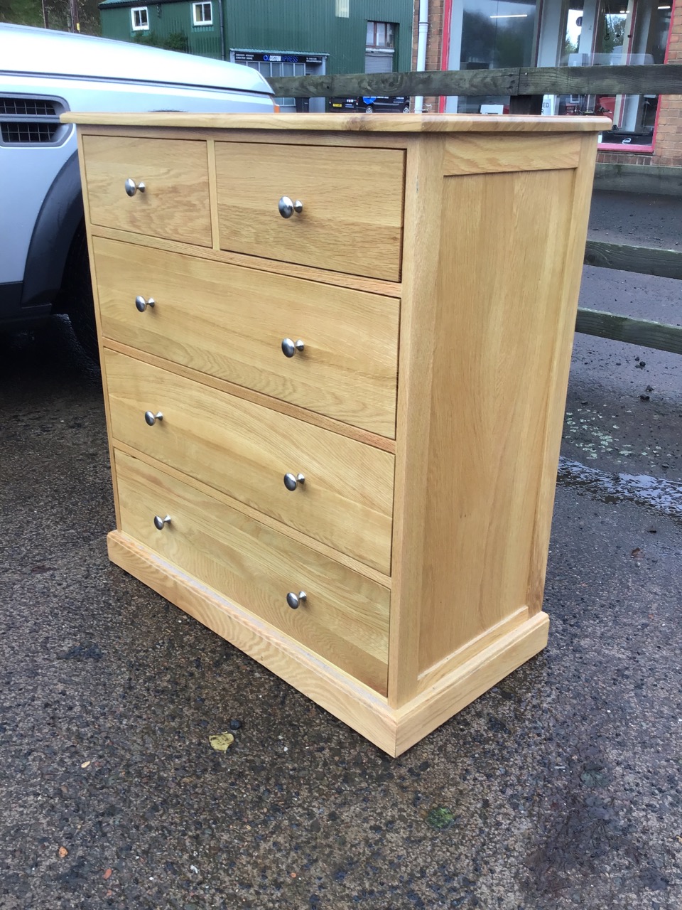 A contemporary oak chest of drawers, the rectangular top above two short and three long knobbed - Image 2 of 3