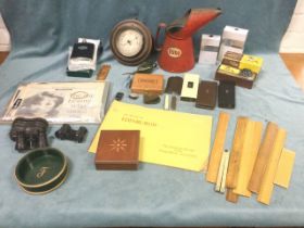 Miscellaneous collectors items including oil cans, rulers, a car compass, two pairs of opera