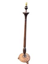 A regency style mahogany standard lamp, the turned fluted column with beaded and palm leaf