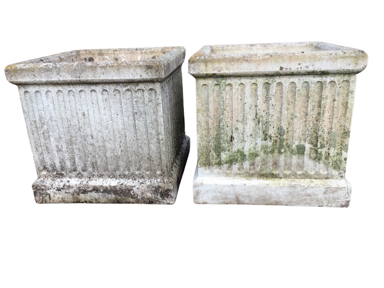 A pair of large square composition stone garden urns with fluted sides and moulded rims. (17.75in