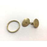 18ct gold wedding ring and one 18ct gold cufflink