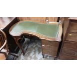 Edwardian mahogany kneehole kidney-shaped desk with lined top, inset glass inkwells, three drawers o