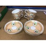 19th century English porcelain cups and saucers painted with fruit