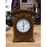 Edwardian Art Nouveau mahogany mantel clock with inlaid decoration,
