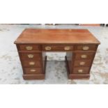 Edwardian mahogany twin pedestal desk with an arrangement of nine drawers with brass handles