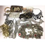 Group of Eastern white metal necklaces, belts, beaded purses and other items