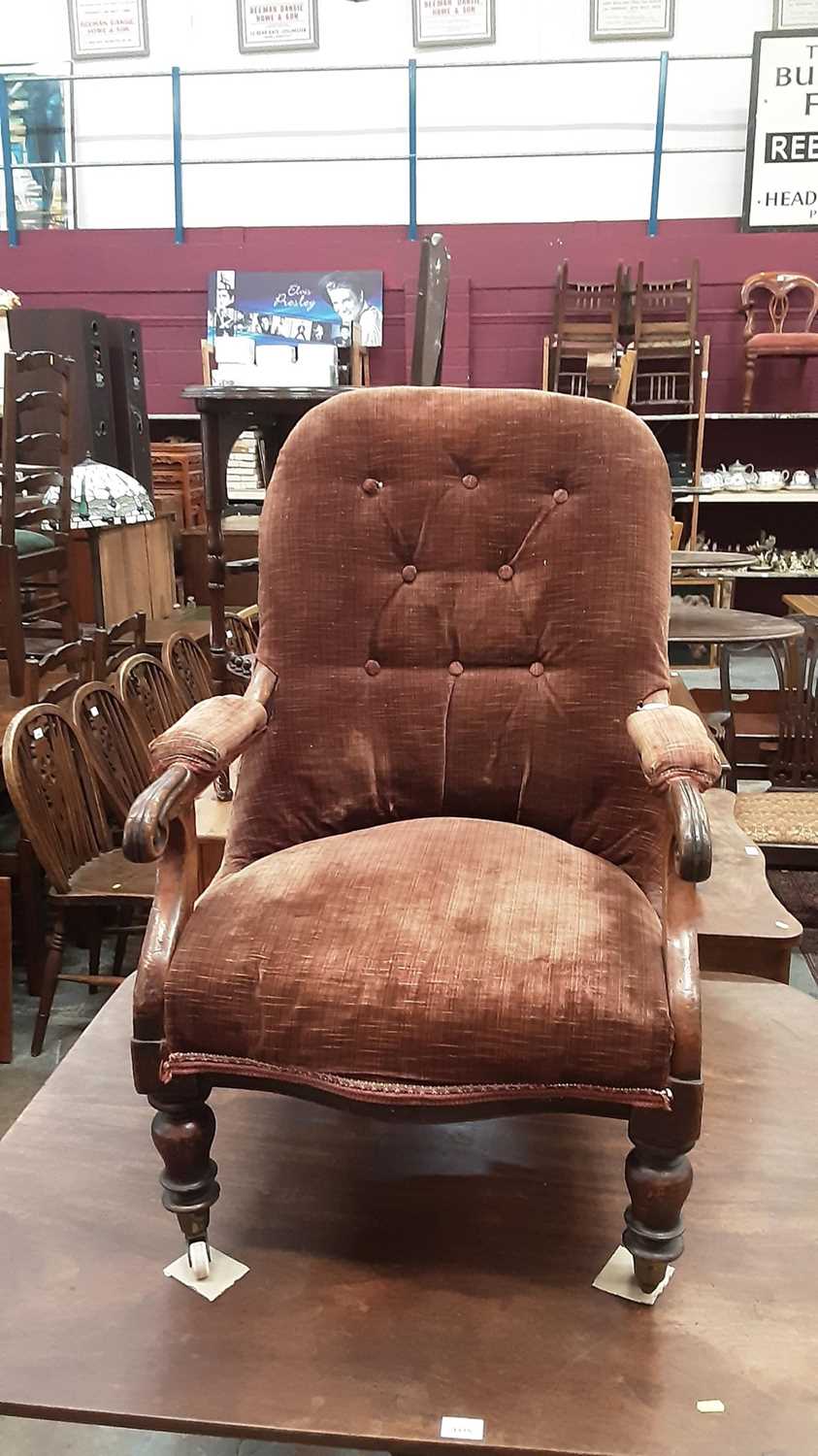 Victorian mahogany buttoned back easy chair with brown velvet upholstery on turned legs