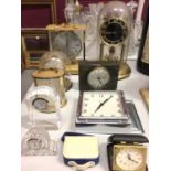 Three Kundo mantle clocks, Waterford crystal desk clock and other timepieces