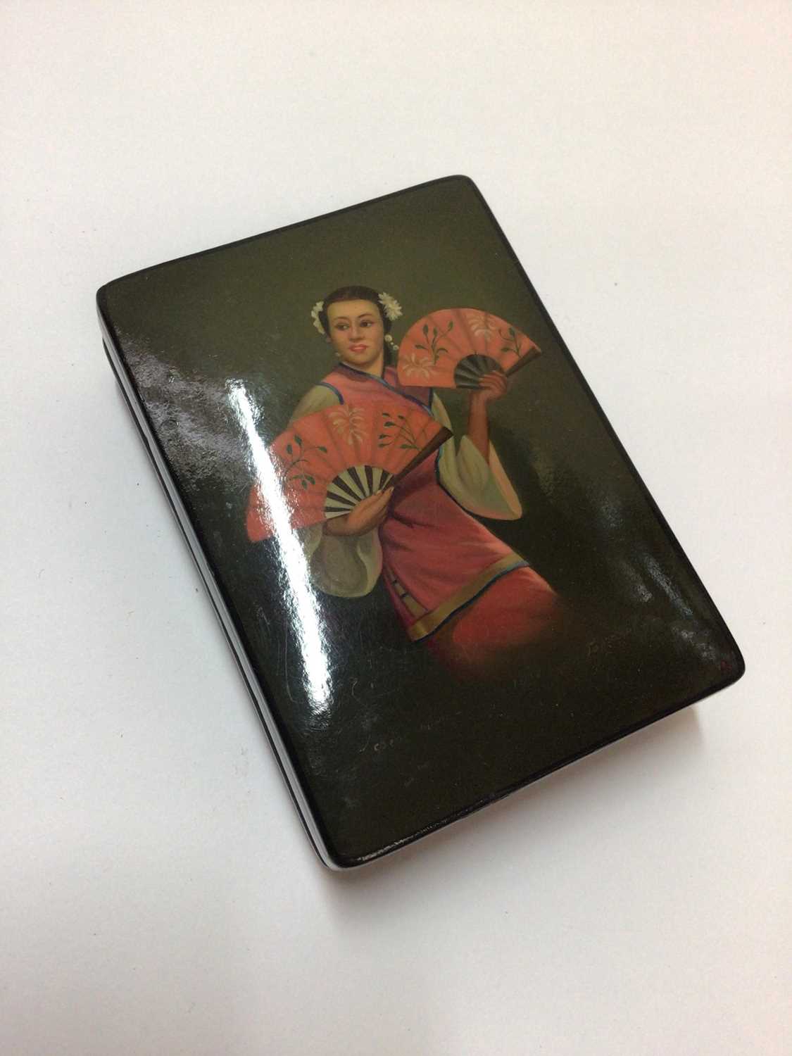 Russian lacquered snuff box, hand painted with a girl holding fans, signed and dated