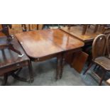 George IV mahogany D end dining table with extra leaf on turned legs and brass castors