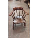 Late Victorian elm and beech captains chair on turned legs joined by stretchers