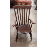 Windsor kitchen elbow chair on turned legs joined by stretchers