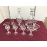 Pair of Regency cut glass decanters, together with 19th century custard cups and wine glasses