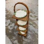 Art Deco walnut plate stand and suite of dishes