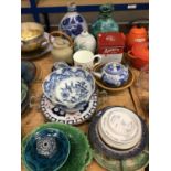 Group of ceramics and glassware, including green majolica dishes, an Imari serving dish, etc