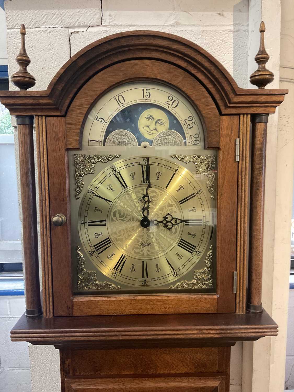 Longcase clock with German 8 day chiming movement, arched brass dial with lunar phase, retailed by F - Image 2 of 4