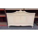 Edwardian cream painted double bedstead with carved foliate and shell cresting, together with a matc