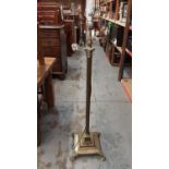 Edwardian brass lamp standard with Corinthian column on stepped square base on paw feet