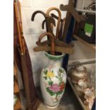 Japanese porcelain vase filled with walking sticks and wooden swords
