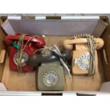Three GPO 746 rotary dial telephones in various colours