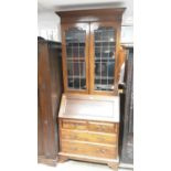 Edwardian walnut two height bureau bookcase with adjustable shelves above enclosed by two leaded gla