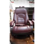 Contemporary leather reclining armchair with matching footstool
