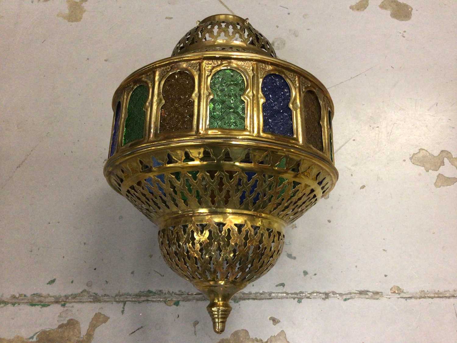 Indian style pierced brass pendent lantern with coloured glass panel and a pair of matching wall lig