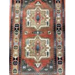 Eastern rug with geometric decoration on orange, blue, green and cream ground, 147cm x 84cm