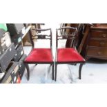 Pair of antique style mahogany dining chairs with red seats