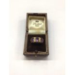 9ct gold amethyst three stone ring interspaced with diamonds, size M½