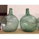 Group of five large glass Spanish wine bottles/ carboys
