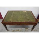 Edwardian oak library table, with inset tooled leather top and two frieze drawers to each side on re