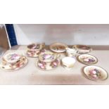 Three Aynsley Orchard Gold fruit pattern cups and four saucers together with milk jug and sugar bowl