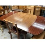 1920's mahogany extending dining table with one extra leaf on carved cabriole legs with claw and bal