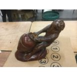 Decorative carved wooden model of a monkey with glass eyes